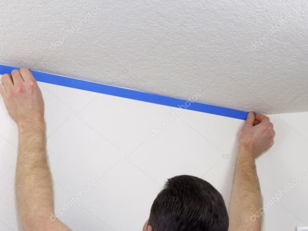 depositphotos_8920691-stock-photo-applying-painters-tape